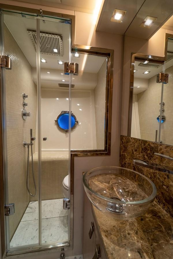 a bathroom with a glass bowl aboard MONTE CARLO YACHTS MCY 76 Yacht for Sale