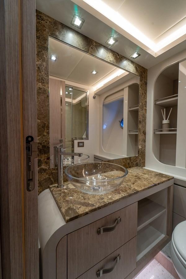 a bathroom with a marble counter top aboard MONTE CARLO YACHTS MCY 76 Yacht for Sale