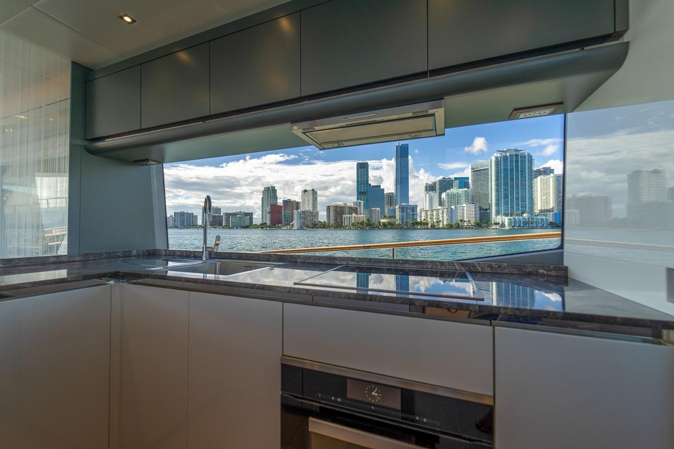 a large window with a city skyline aboard MONTE CARLO YACHTS MCY 76 Yacht for Sale