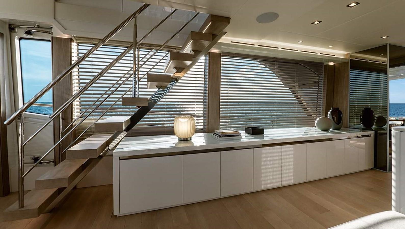 a room with a large white staircase aboard MONTE CARLO SKYLOUNGE  Yacht for Sale