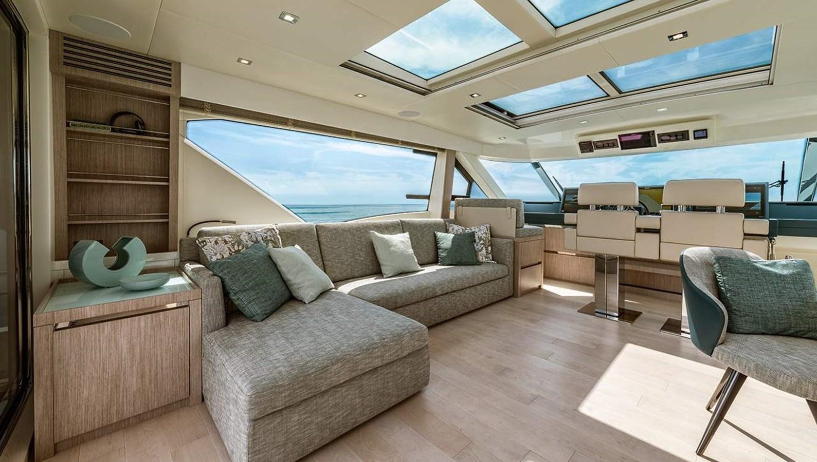a living room with a couch and a tv aboard MONTE CARLO SKYLOUNGE  Yacht for Sale