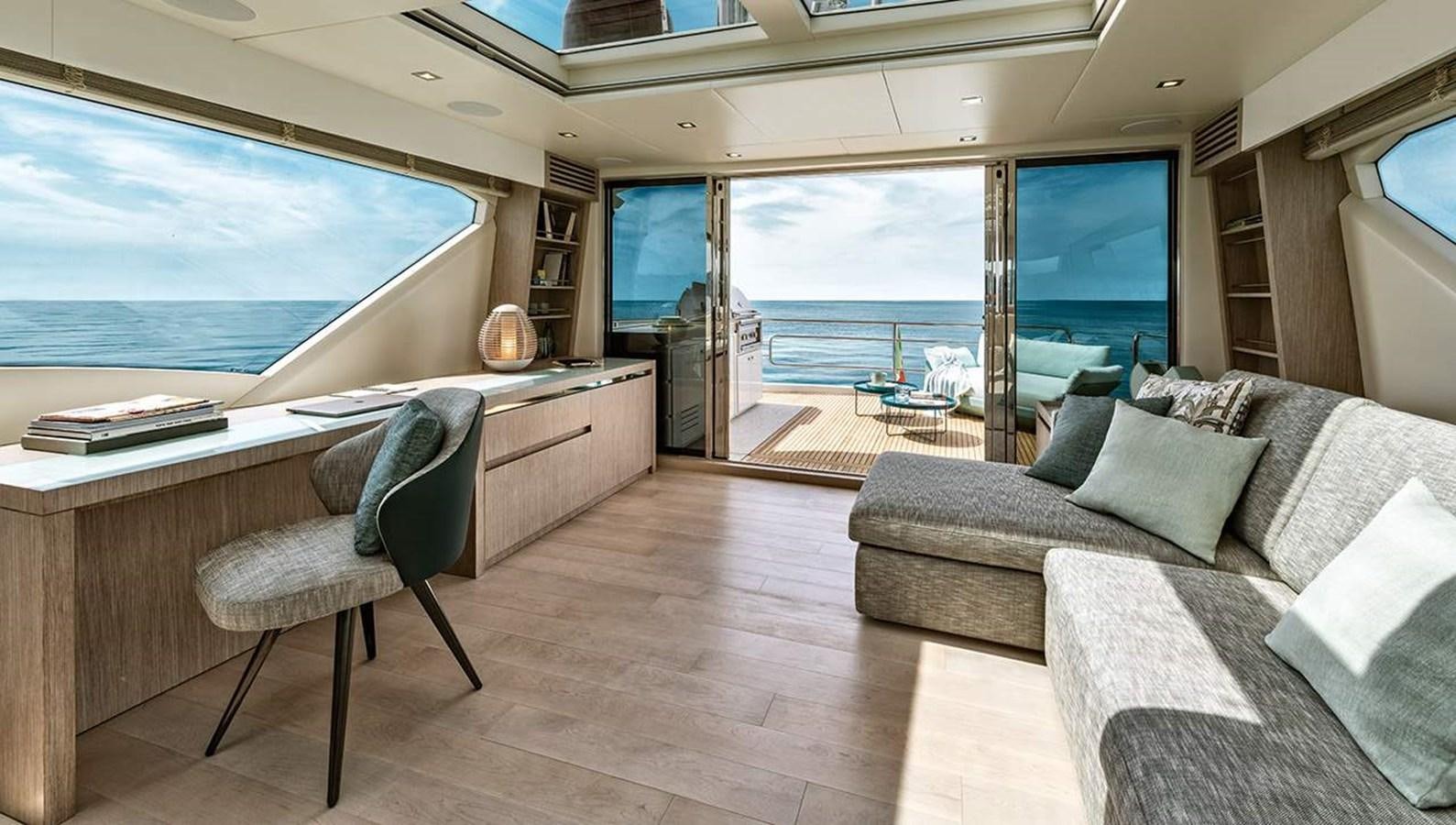 a living room with a large window aboard MONTE CARLO SKYLOUNGE  Yacht for Sale