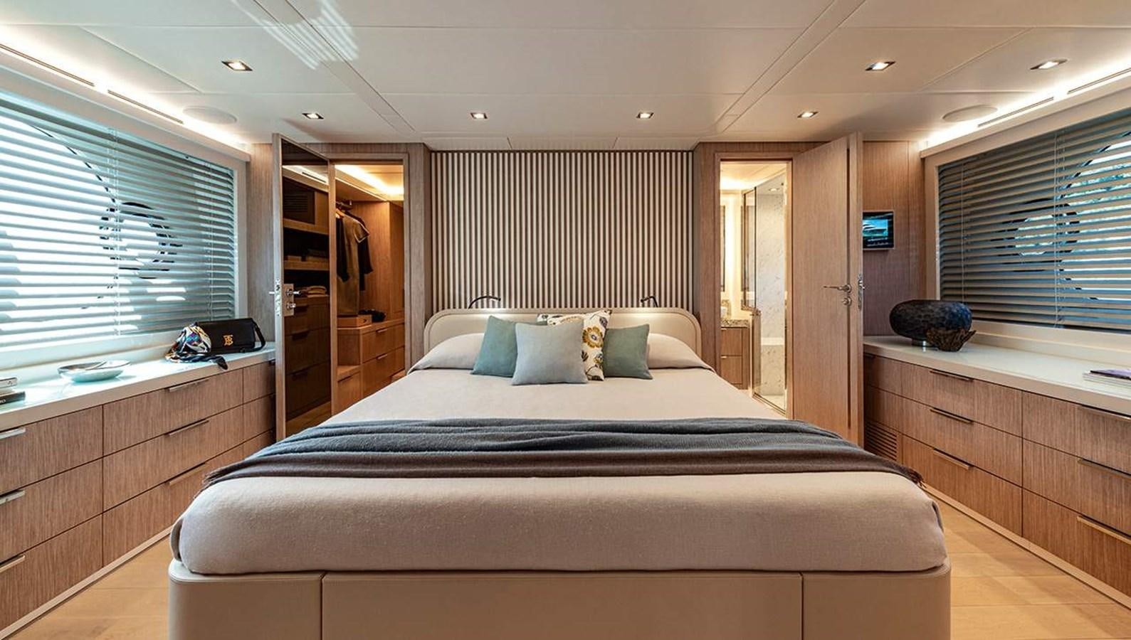 a bedroom with a large bed aboard MONTE CARLO SKYLOUNGE  Yacht for Sale