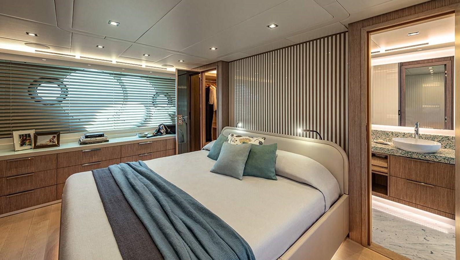 a bed with a sink and a mirror in a room aboard MONTE CARLO SKYLOUNGE  Yacht for Sale