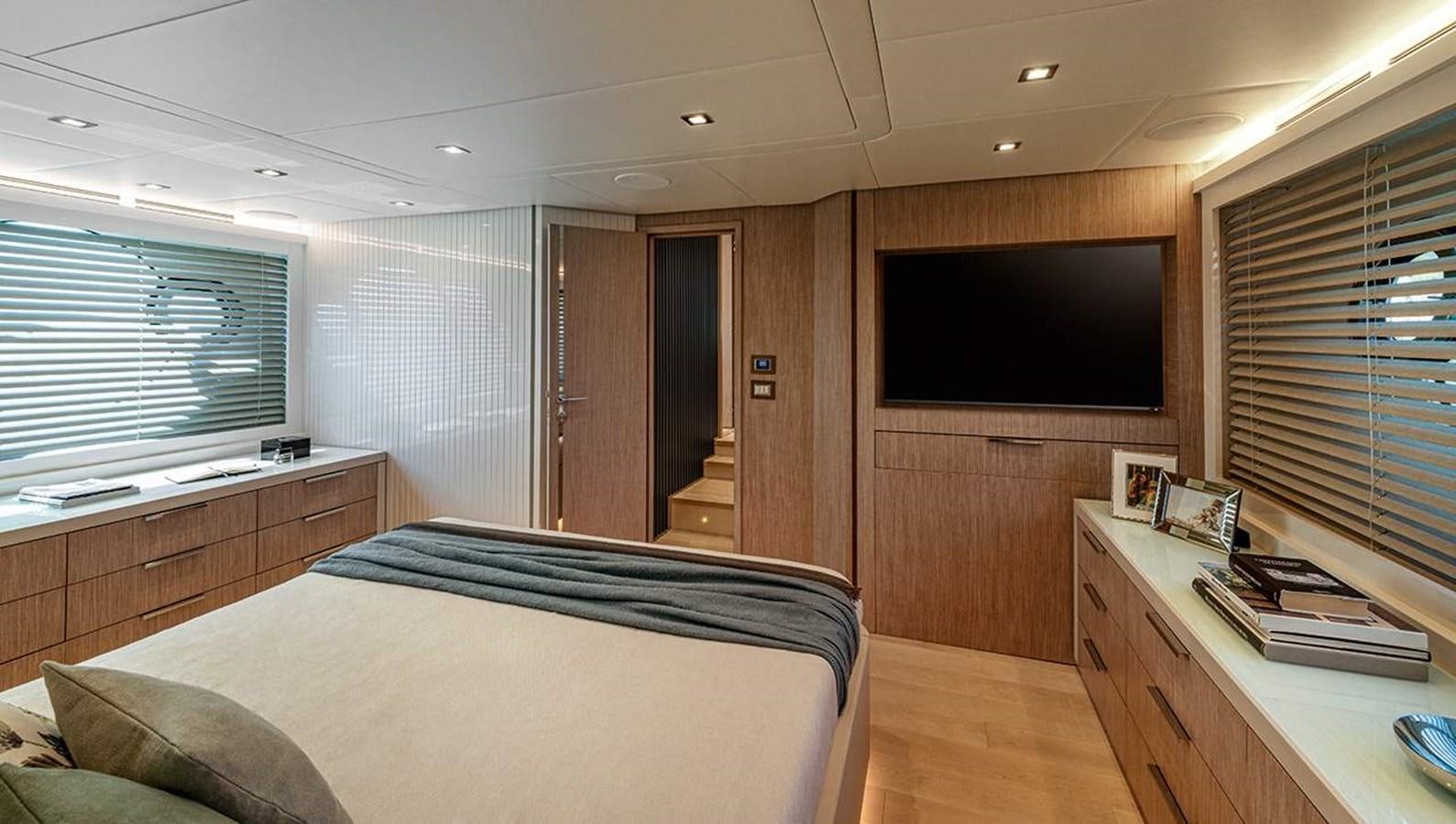 a bedroom with a bed and a tv aboard MONTE CARLO SKYLOUNGE  Yacht for Sale