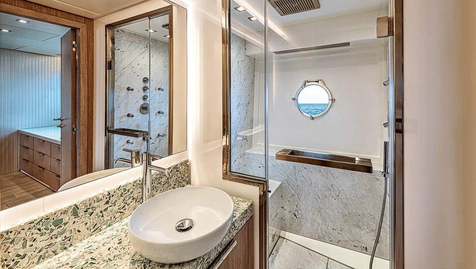a bathroom with a sink and a mirror aboard MONTE CARLO SKYLOUNGE  Yacht for Sale