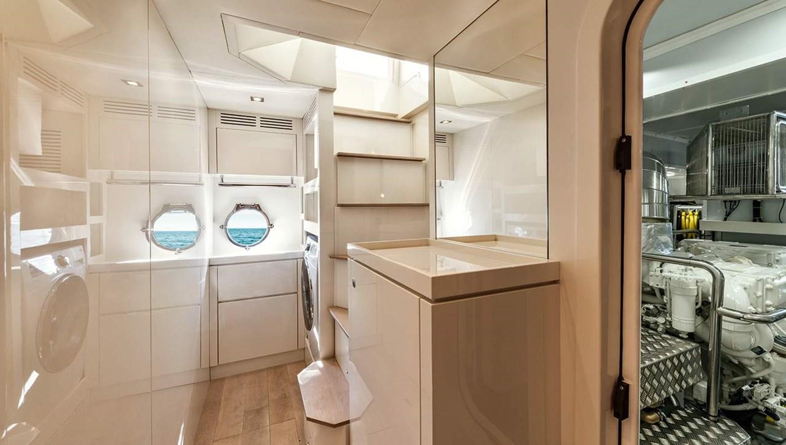 a room with a white wall and cabinets aboard MONTE CARLO SKYLOUNGE  Yacht for Sale
