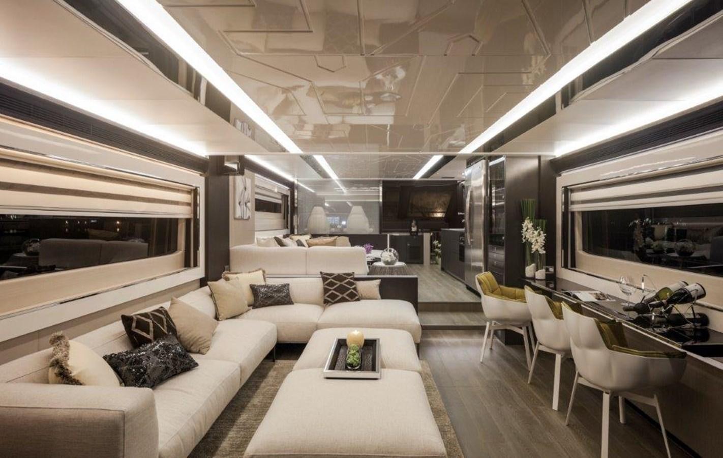 a living room with a large white sofa and a large tv aboard V72 (NEW BOAT SPEC)  Yacht for Sale