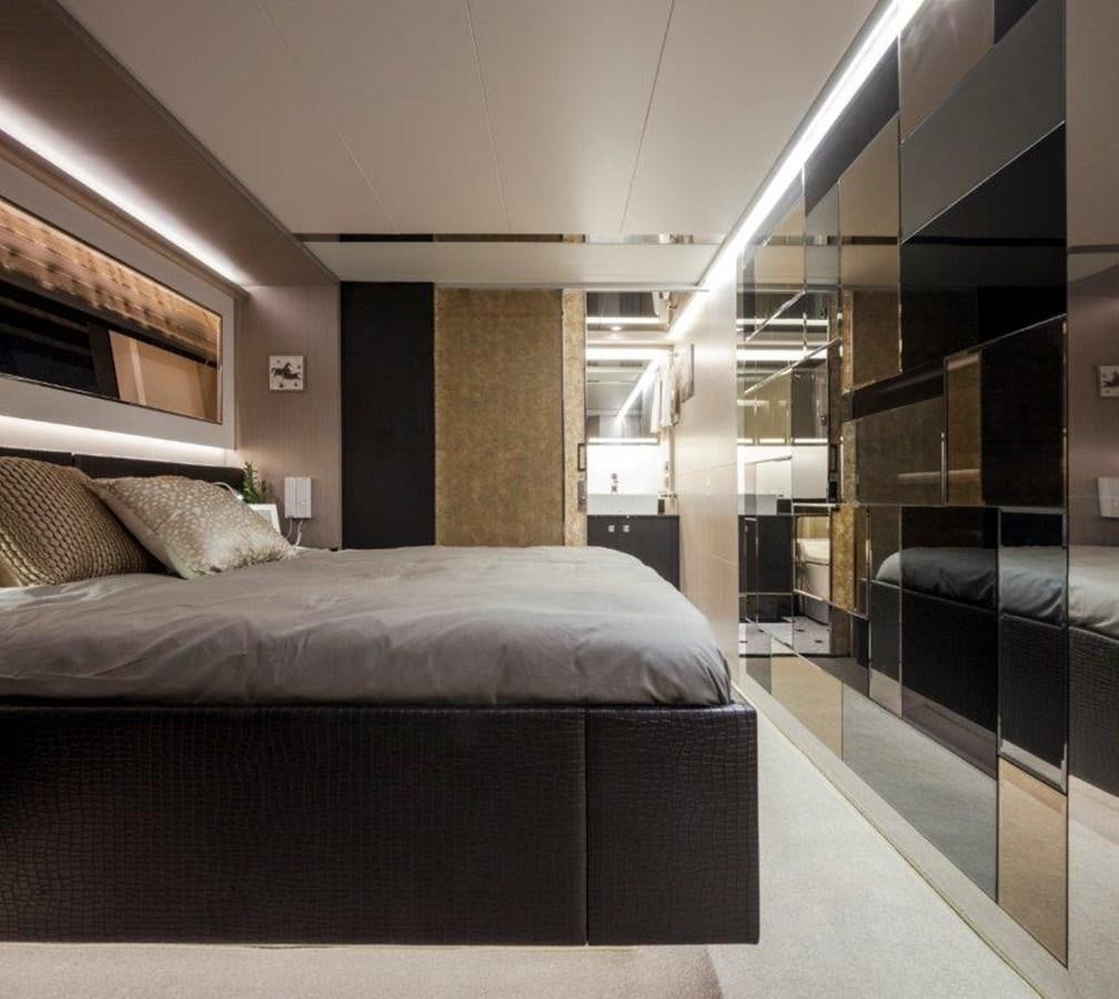 a bedroom with a bed and a mirror aboard V72 (NEW BOAT SPEC)  Yacht for Sale