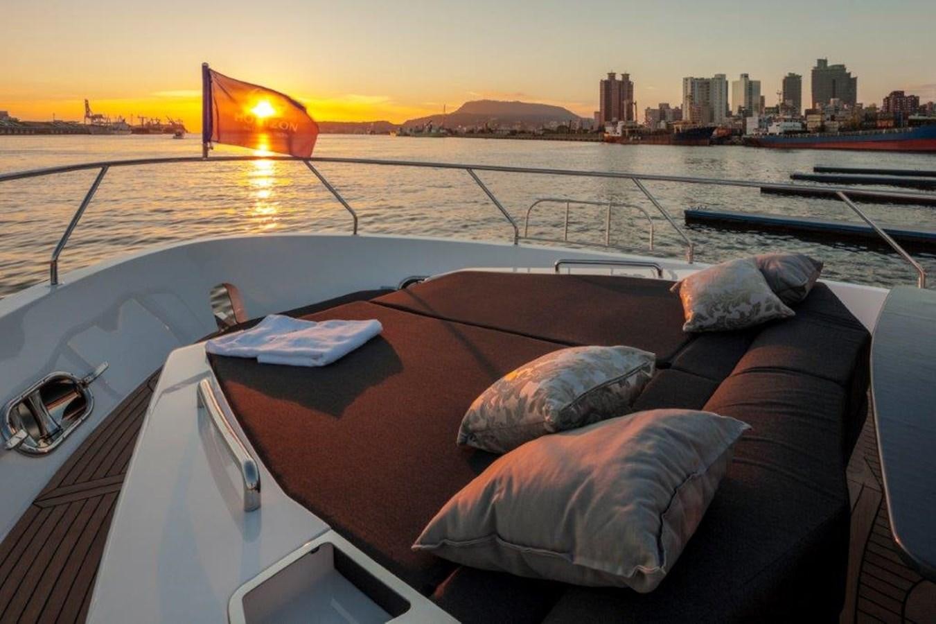 a couple of large rocks on a boat in the water with a city in the background aboard V72 (NEW BOAT SPEC)  Yacht for Sale