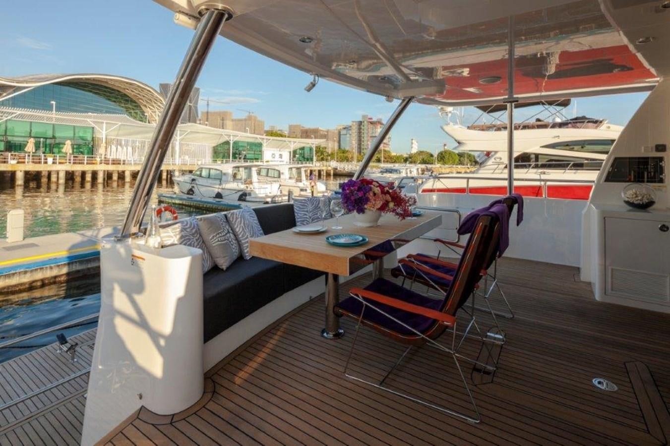 a table and chairs on a deck aboard V72 (NEW BOAT SPEC)  Yacht for Sale