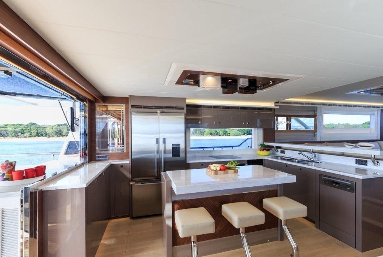 a kitchen with a large island aboard V72 (NEW BOAT SPEC)  Yacht for Sale