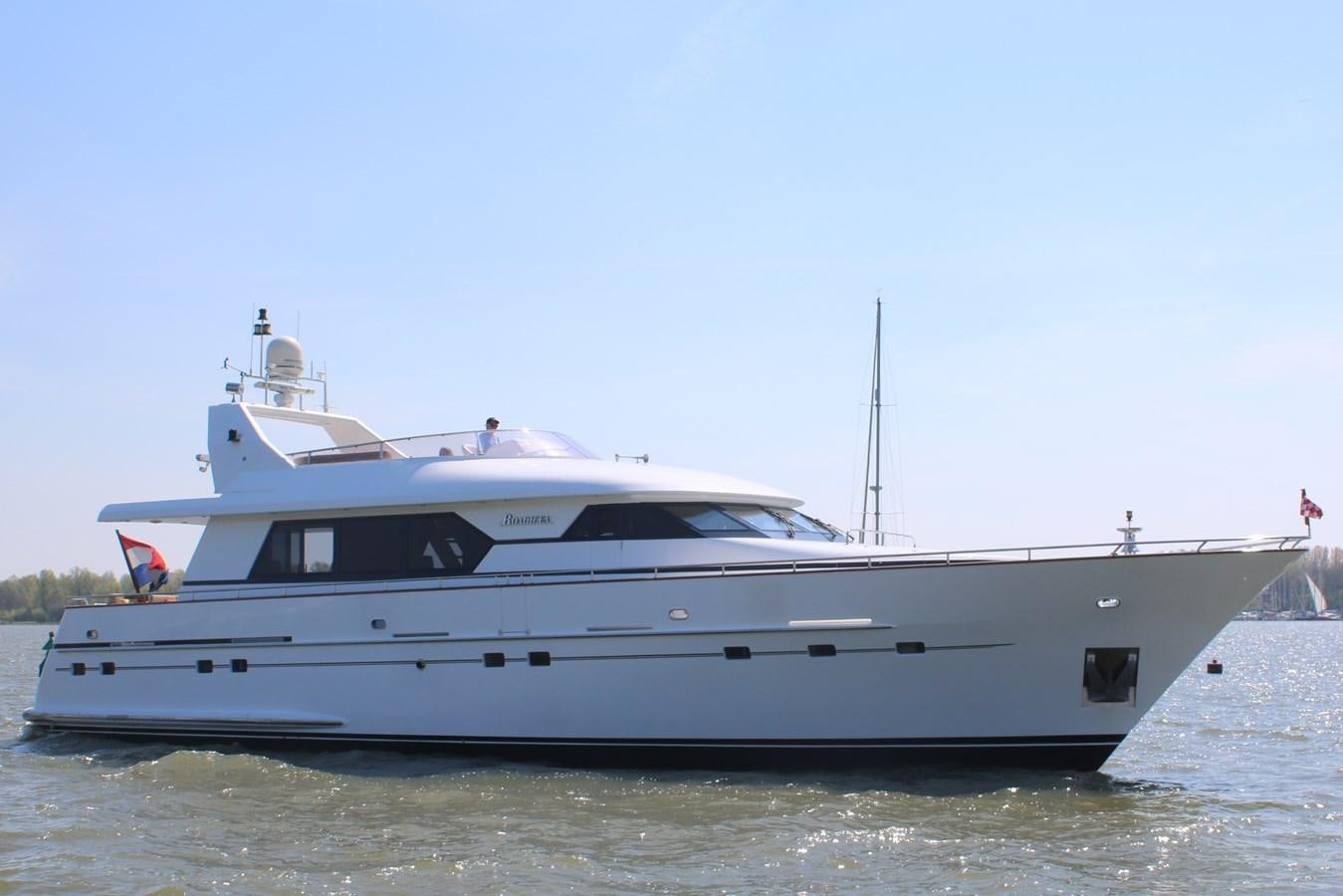 a white yacht on the water aboard BOADICEA Yacht for Sale