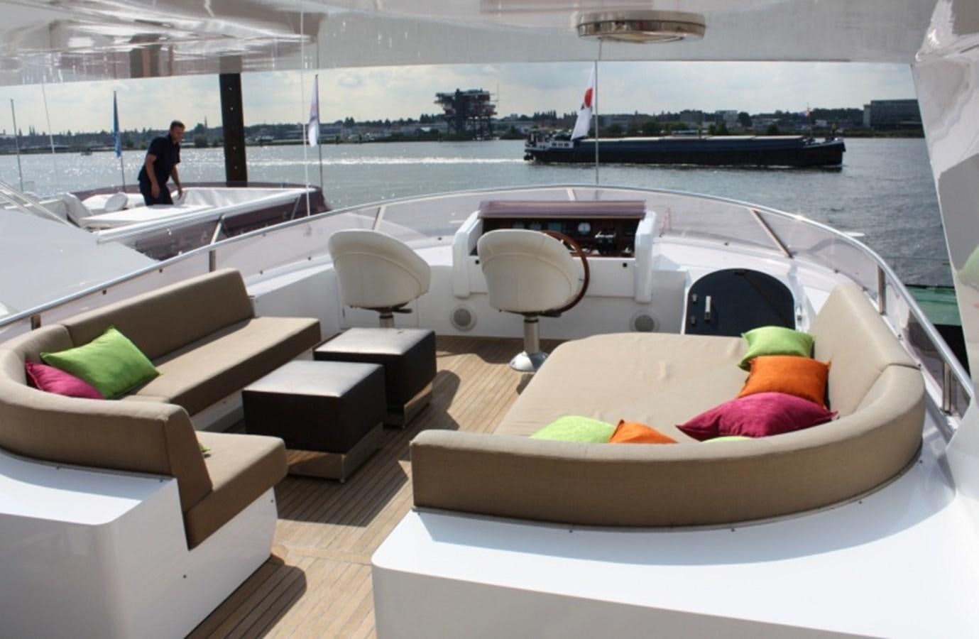 a room with a table and chairs aboard BOADICEA Yacht for Sale