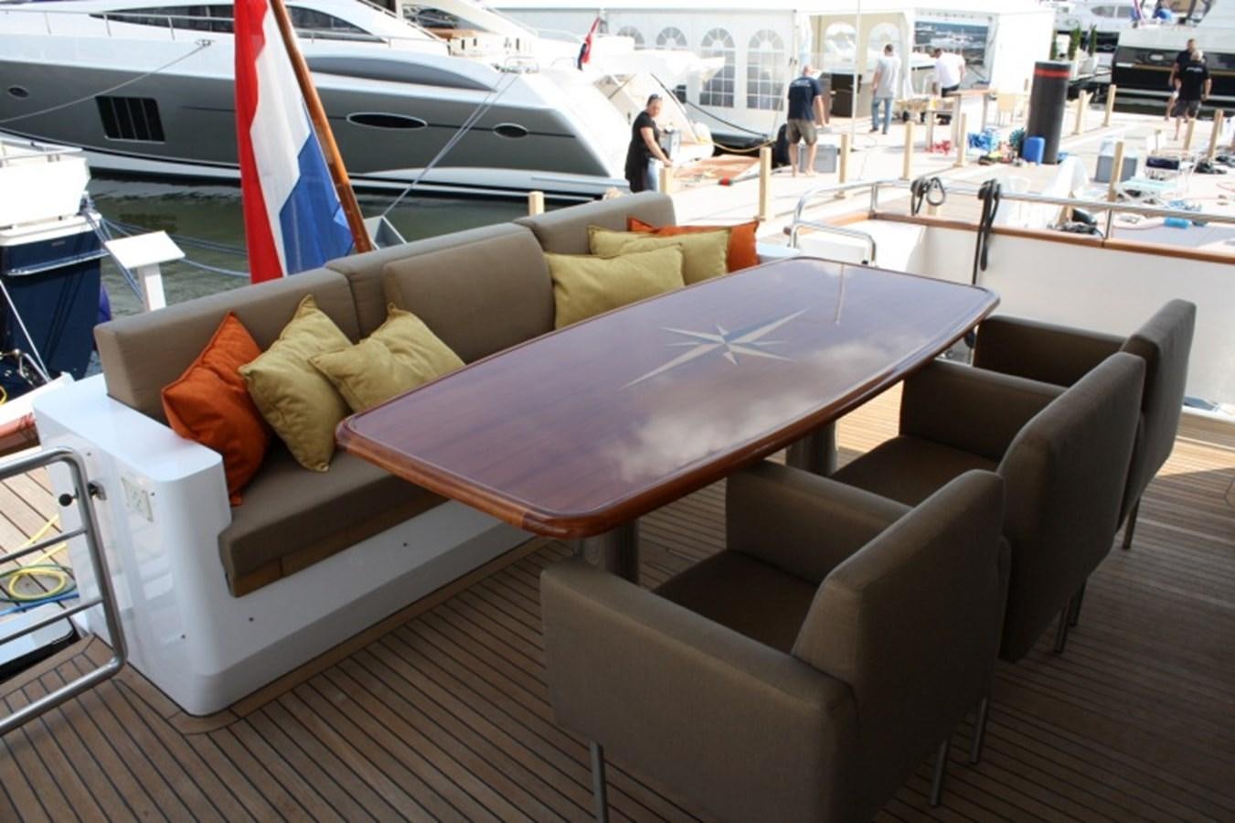 a couch with a flag on it aboard BOADICEA Yacht for Sale