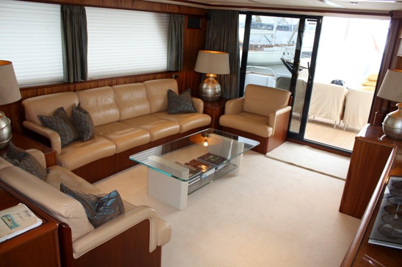 a living room with a large window aboard BOADICEA Yacht for Sale