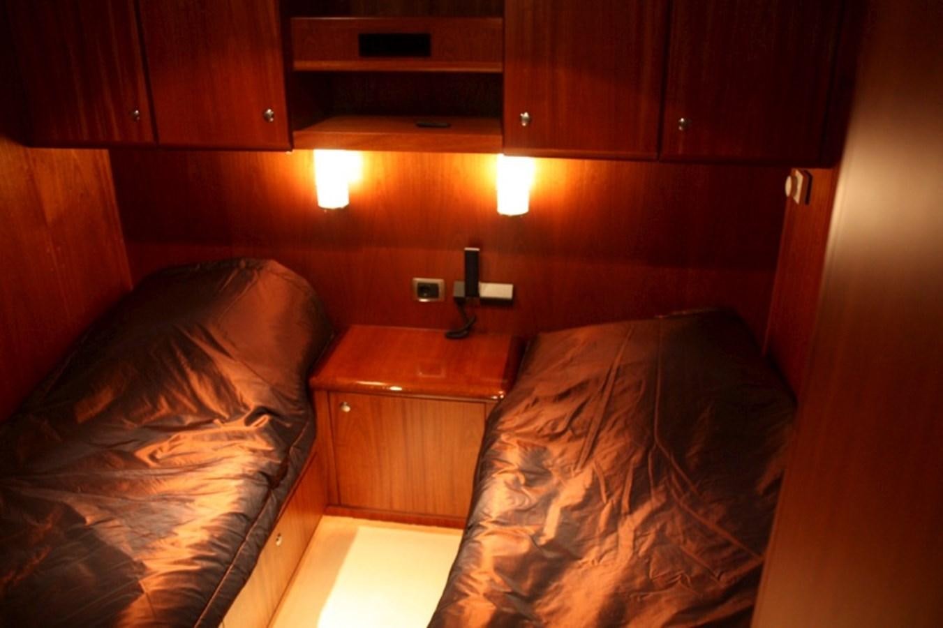 a bed in a room aboard BOADICEA Yacht for Sale
