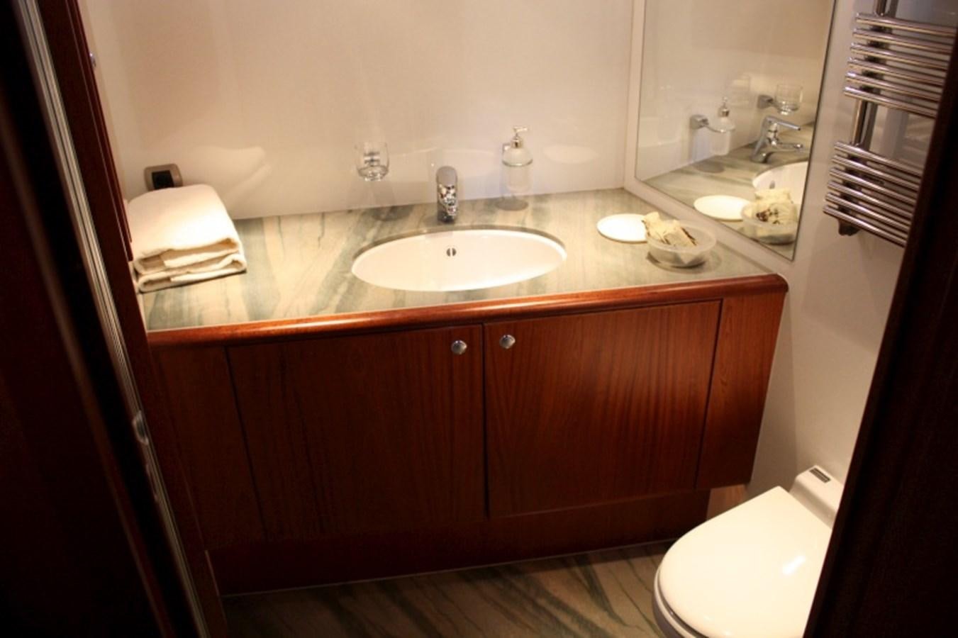 a bathroom with a sink and a toilet aboard BOADICEA Yacht for Sale