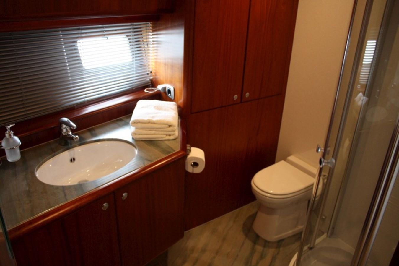 a bathroom with a sink toilet and a shower aboard BOADICEA Yacht for Sale