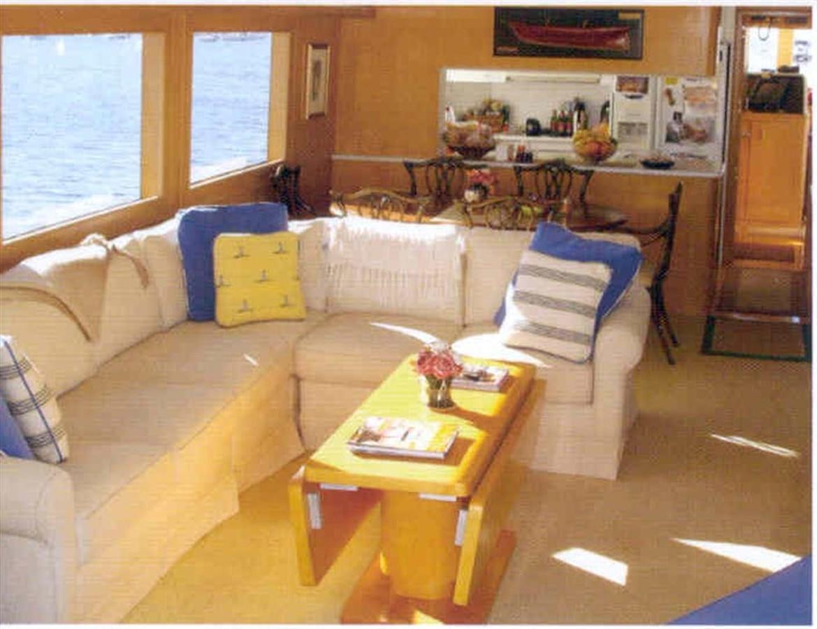 a living room with a couch and a coffee table aboard WHALE'S WAY Yacht for Sale