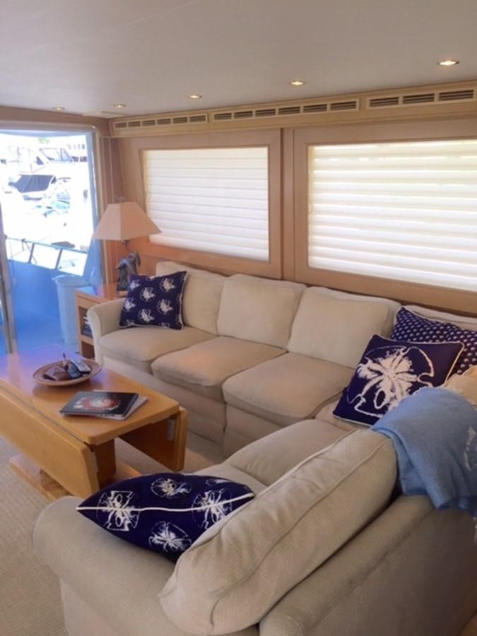 a living room with a couch and a coffee table aboard WHALE'S WAY Yacht for Sale