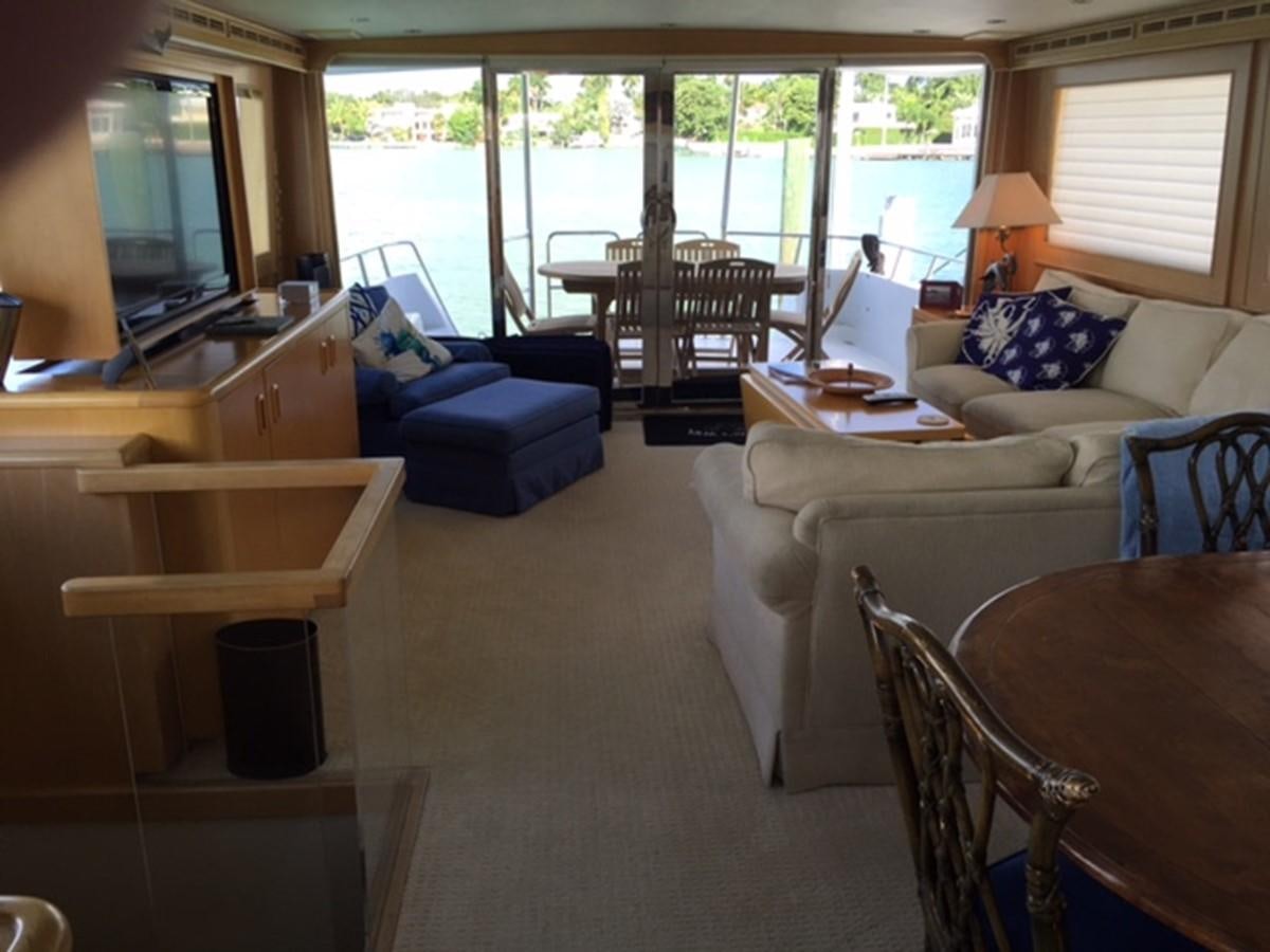 a living room with a large window aboard WHALE'S WAY Yacht for Sale
