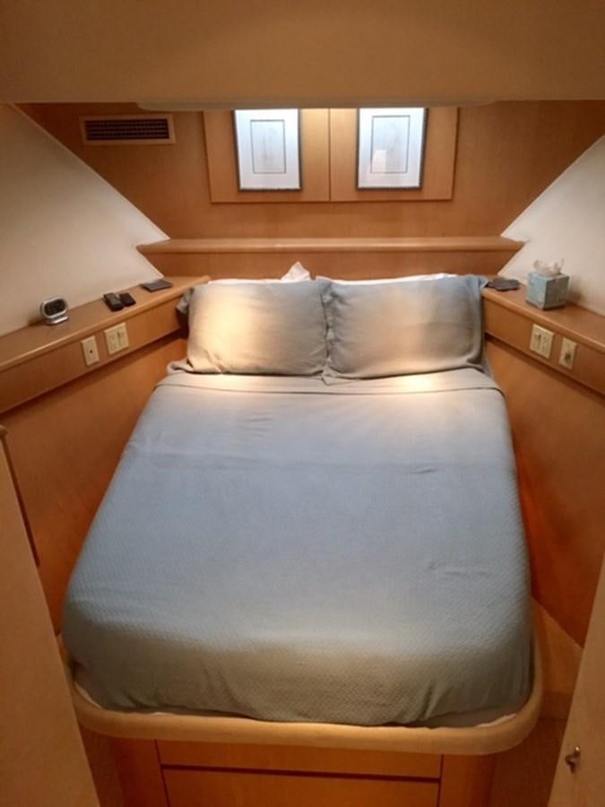 a bed with a white comforter aboard WHALE'S WAY Yacht for Sale