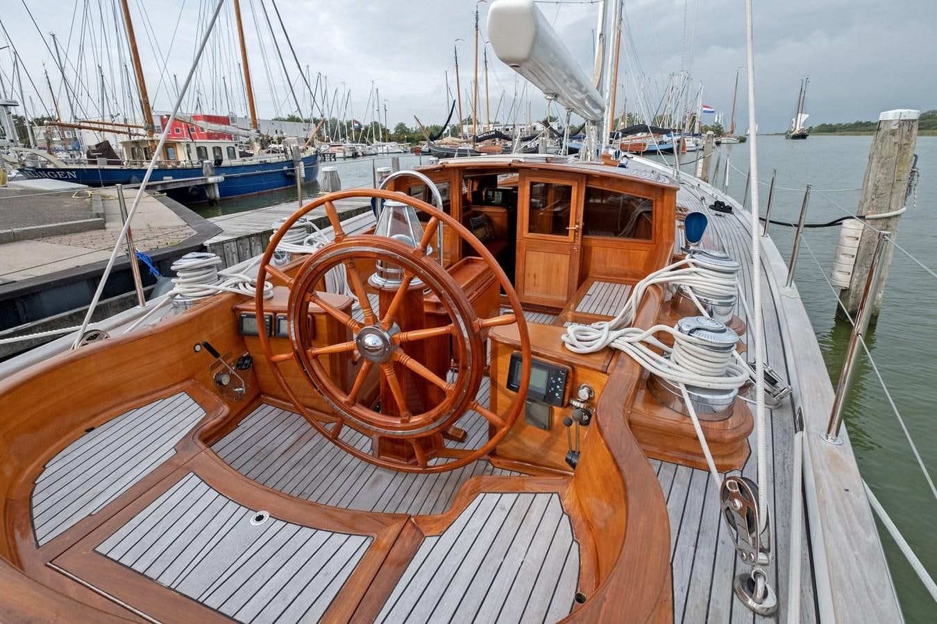 a wooden boat with a steering wheel aboard HOEK CLASSIC 73 DIXBAY Yacht for Sale