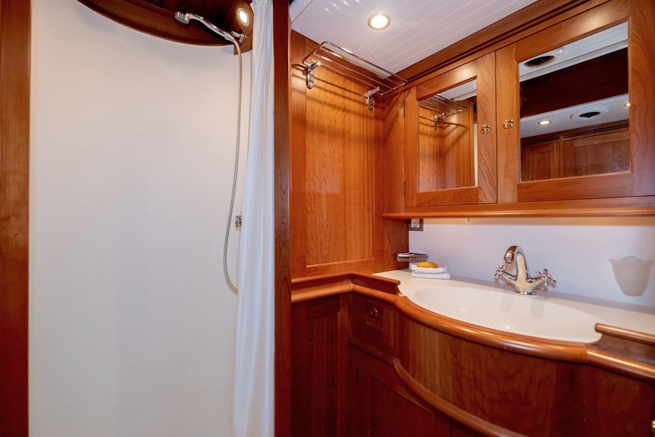 a bathroom with a sink and cabinets aboard HOEK CLASSIC 73 DIXBAY Yacht for Sale