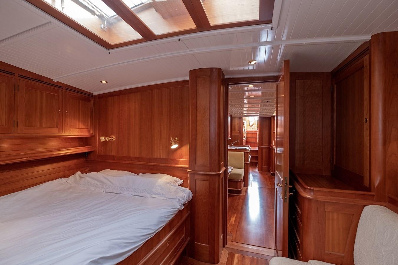 a room with wooden furniture aboard HOEK CLASSIC 73 DIXBAY Yacht for Sale