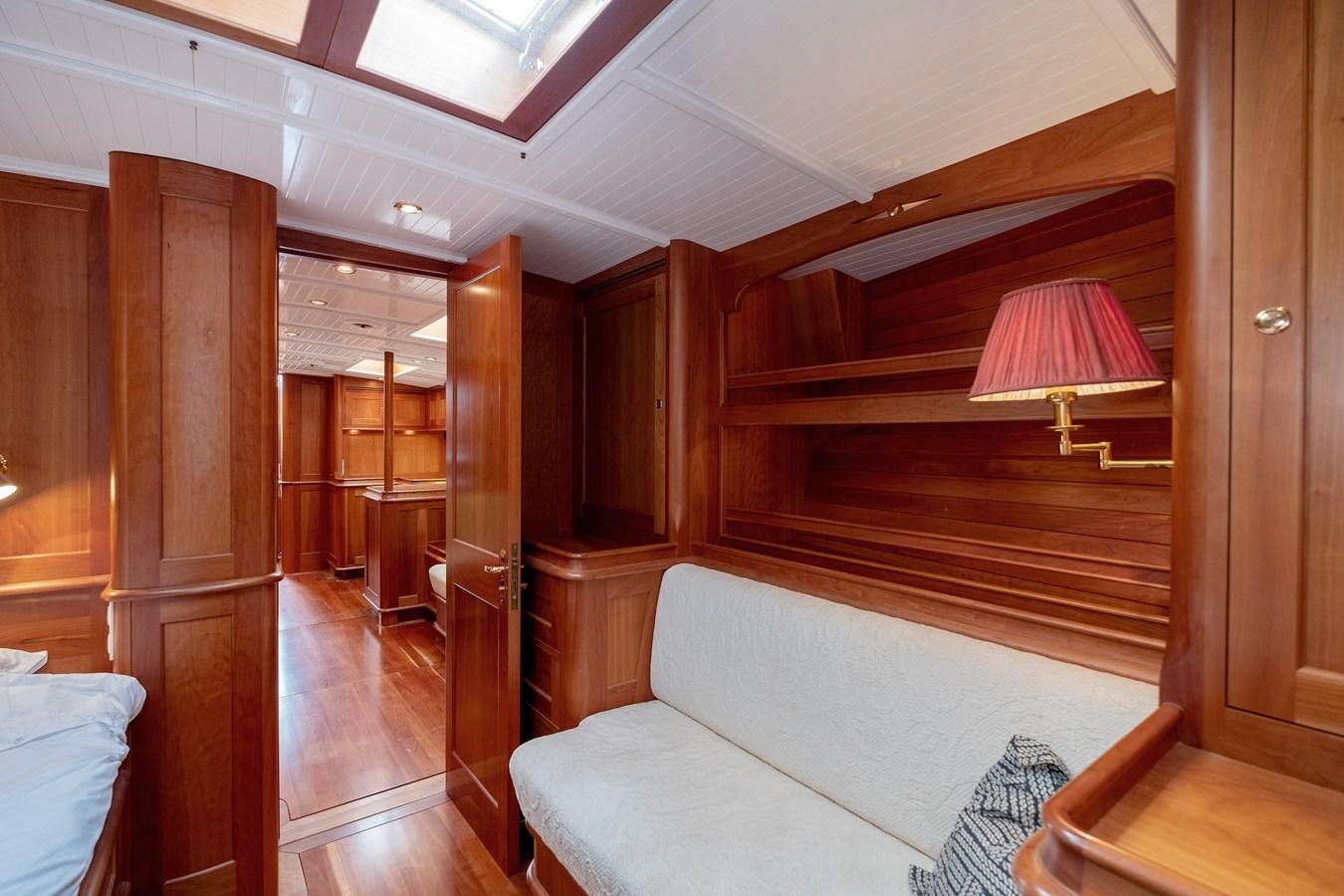 a room with a couch and a lamp aboard HOEK CLASSIC 73 DIXBAY Yacht for Sale
