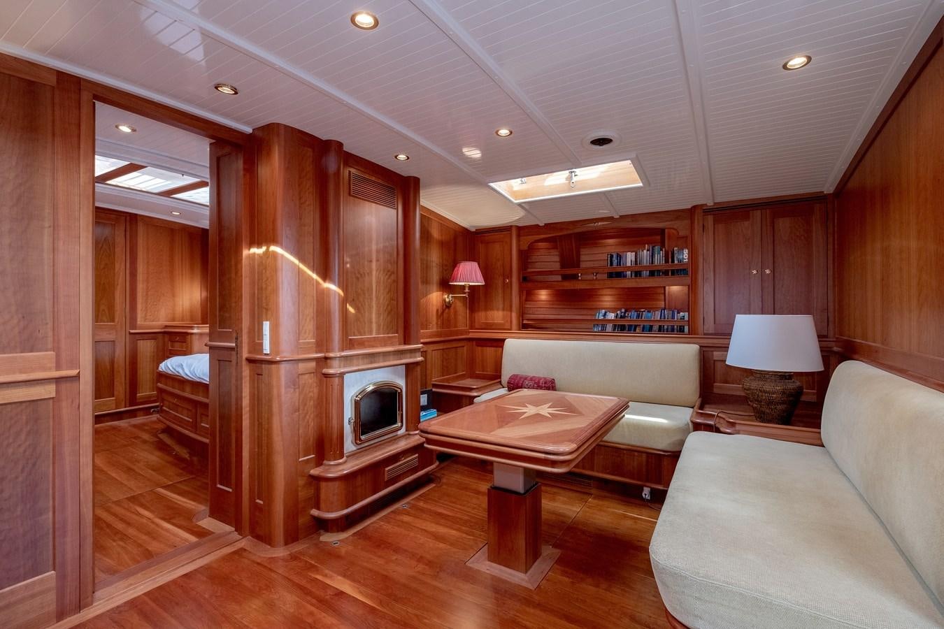 a living room with a fireplace aboard HOEK CLASSIC 73 DIXBAY Yacht for Sale