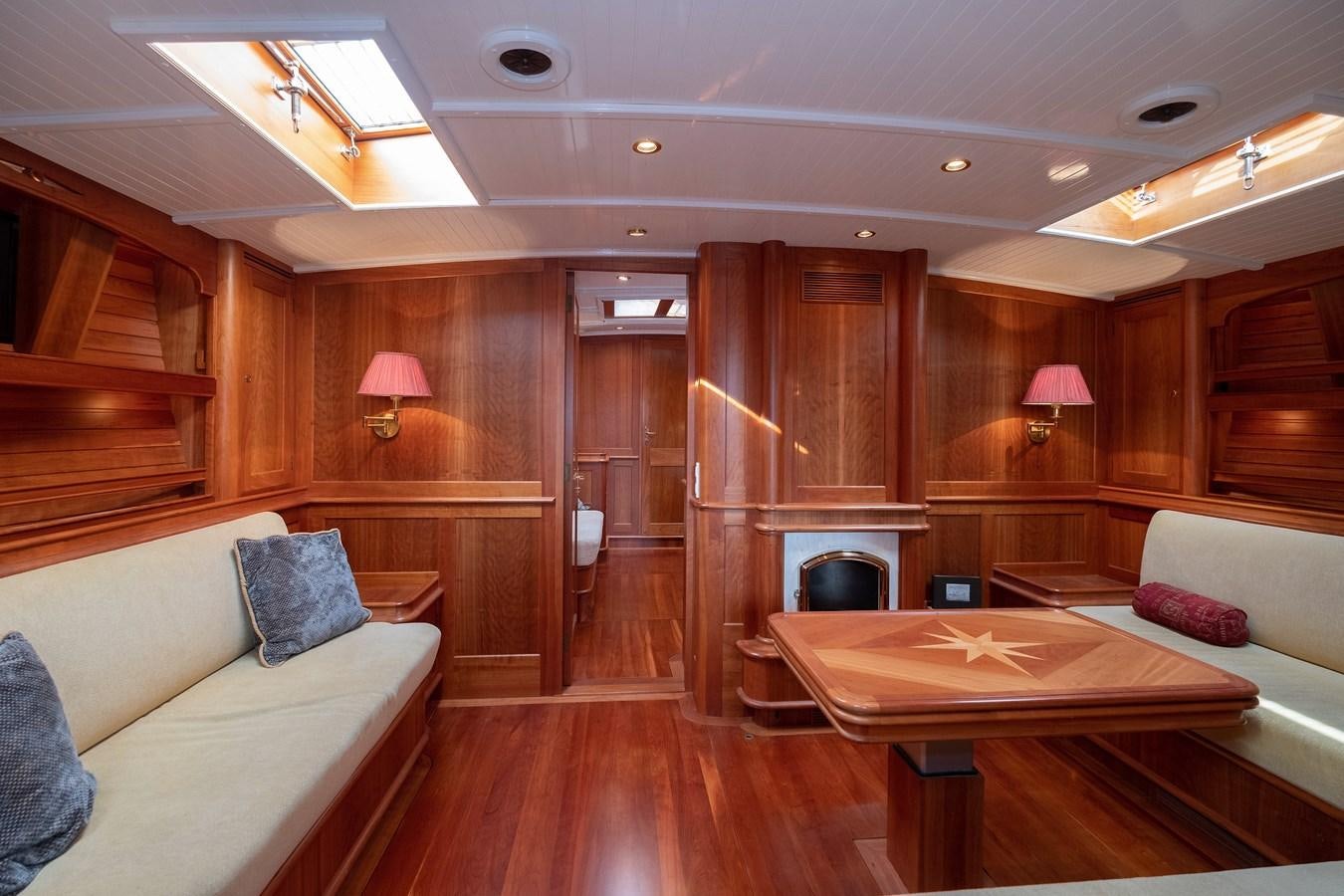 a living room with a couch and a table aboard HOEK CLASSIC 73 DIXBAY Yacht for Sale