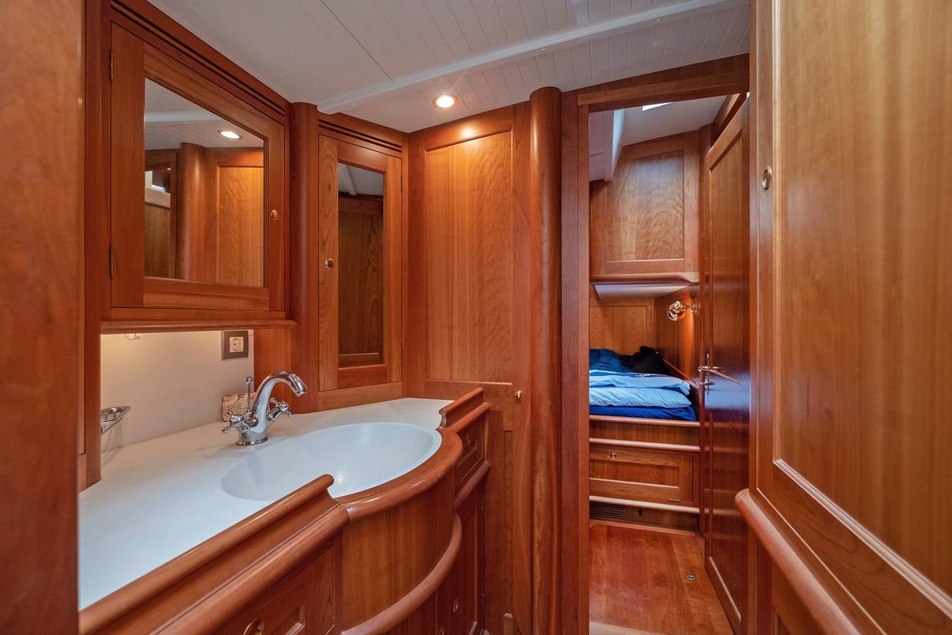 a bathroom with a sink and a mirror aboard HOEK CLASSIC 73 DIXBAY Yacht for Sale