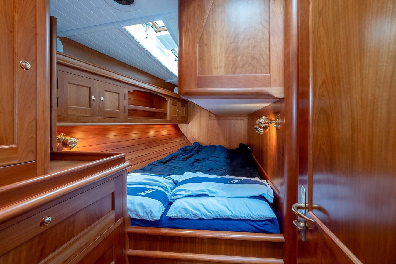 a room with wooden cabinets aboard HOEK CLASSIC 73 DIXBAY Yacht for Sale