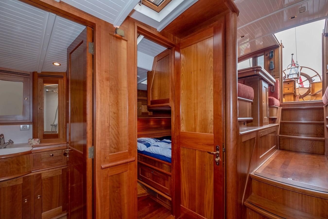 a room with wooden cabinets aboard HOEK CLASSIC 73 DIXBAY Yacht for Sale