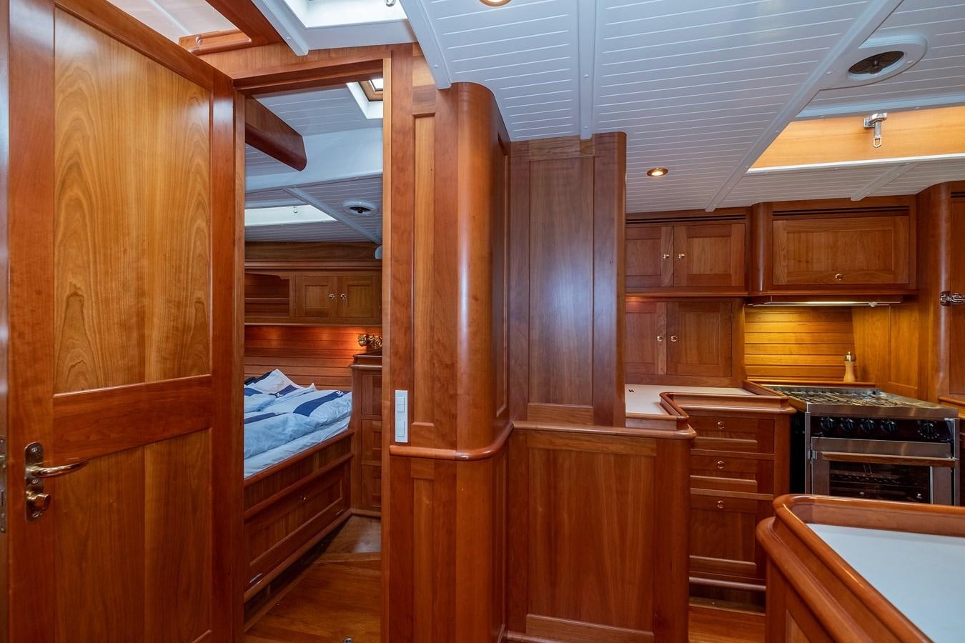 a room with wooden cabinets aboard HOEK CLASSIC 73 DIXBAY Yacht for Sale
