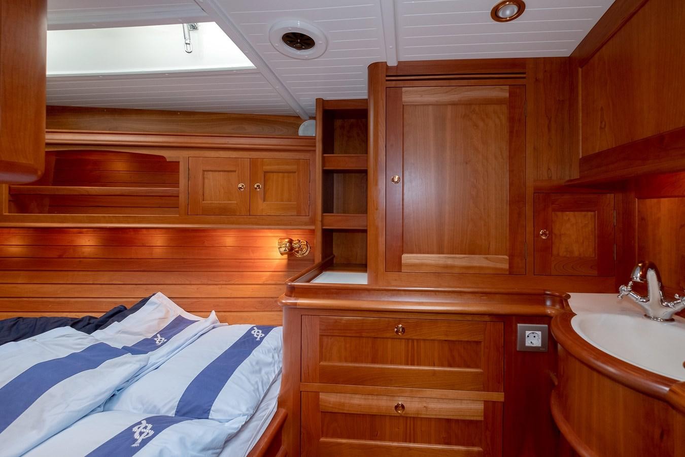 a wooden cabin with a bed aboard HOEK CLASSIC 73 DIXBAY Yacht for Sale