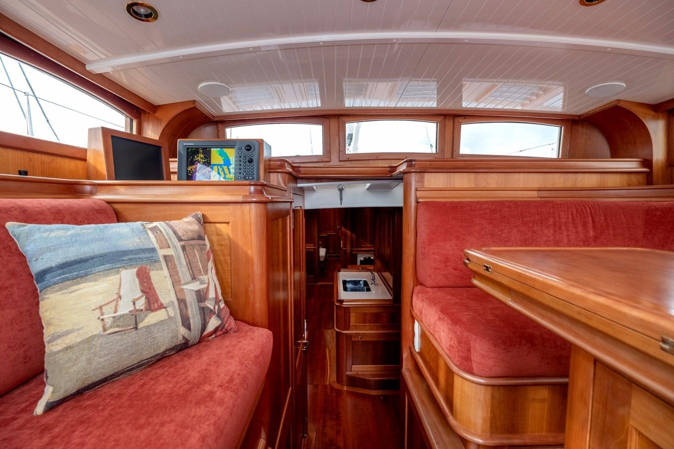 a cabin with a couch and a television aboard HOEK CLASSIC 73 DIXBAY Yacht for Sale