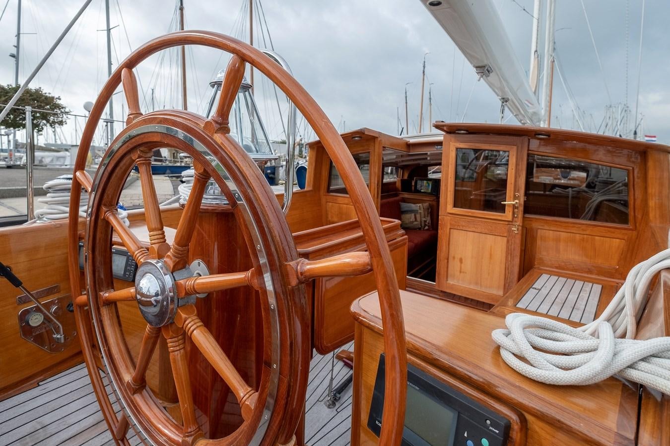 a wooden boat with a steering wheel aboard HOEK CLASSIC 73 DIXBAY Yacht for Sale