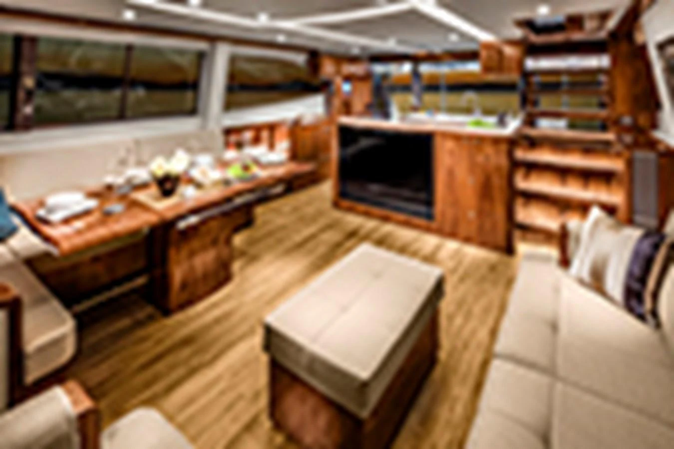a room with a table and tv aboard RIVIERA 72 SPORTS MOTOR YACHT Yacht for Sale