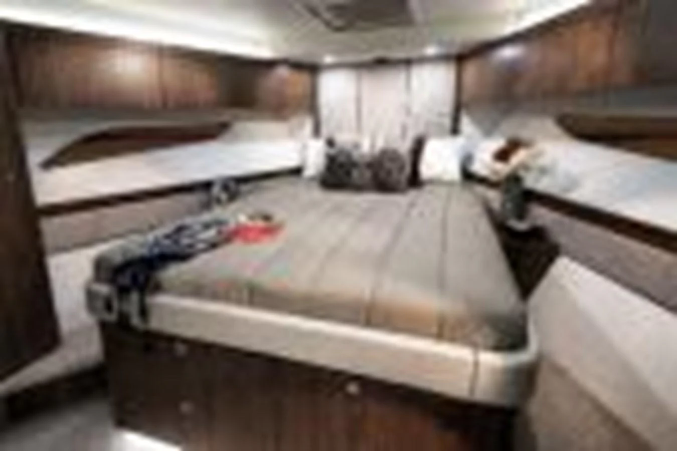 a room with a bed and a couch aboard RIVIERA 72 SPORTS MOTOR YACHT Yacht for Sale