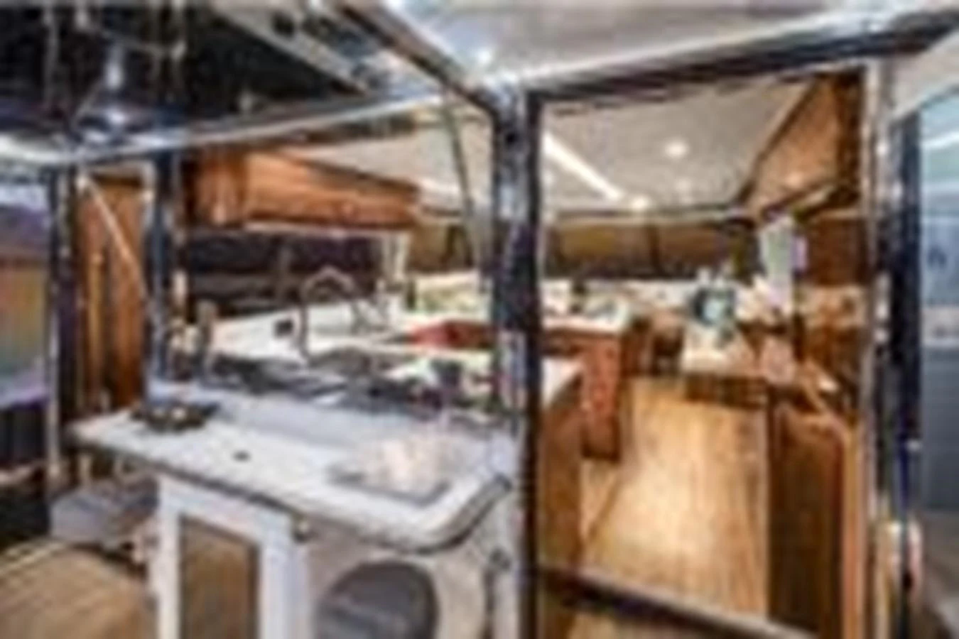 a room with a lot of wood aboard RIVIERA 72 SPORTS MOTOR YACHT Yacht for Sale