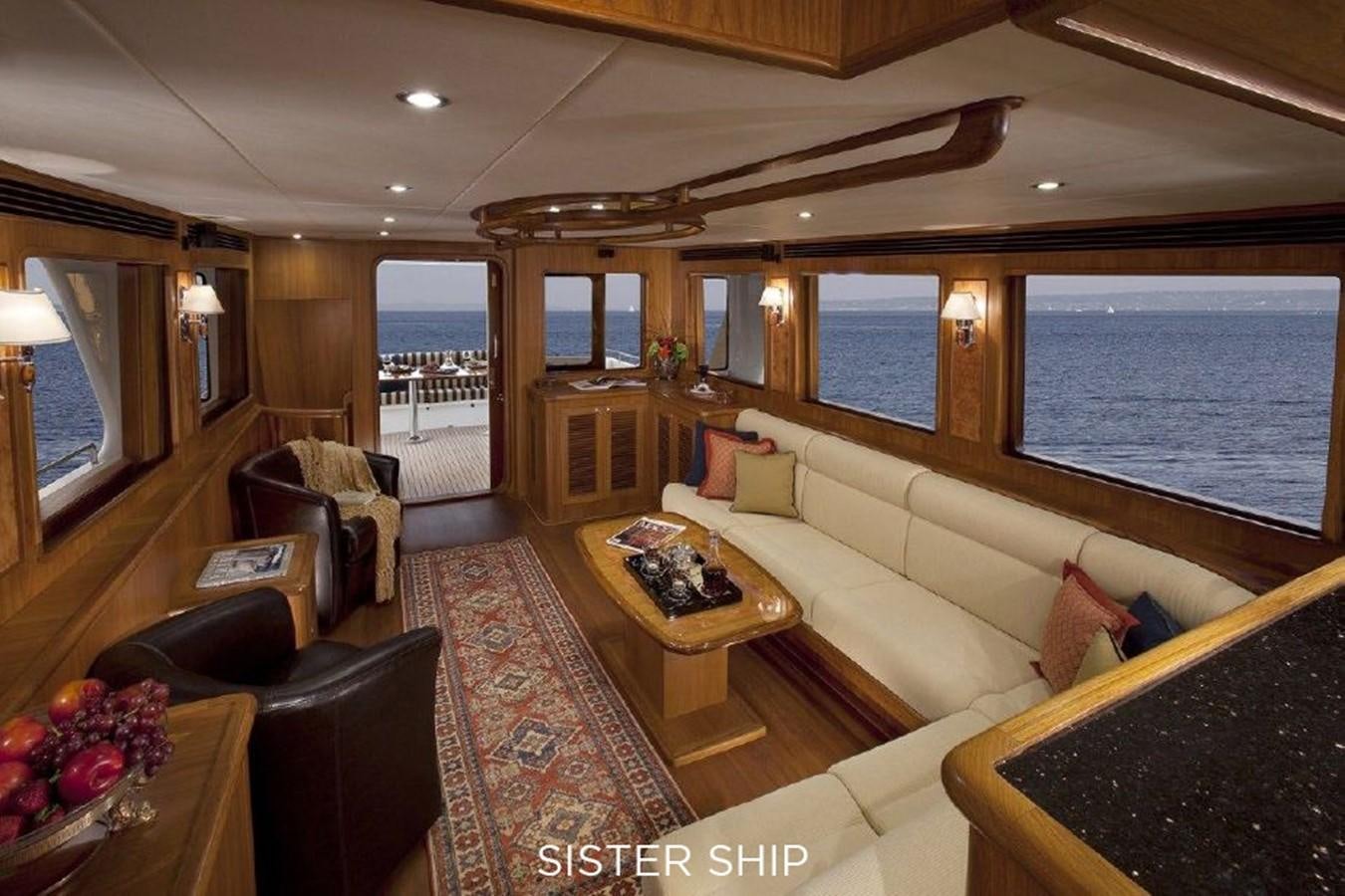 a living room with a large window aboard 700 MY Yacht for Sale
