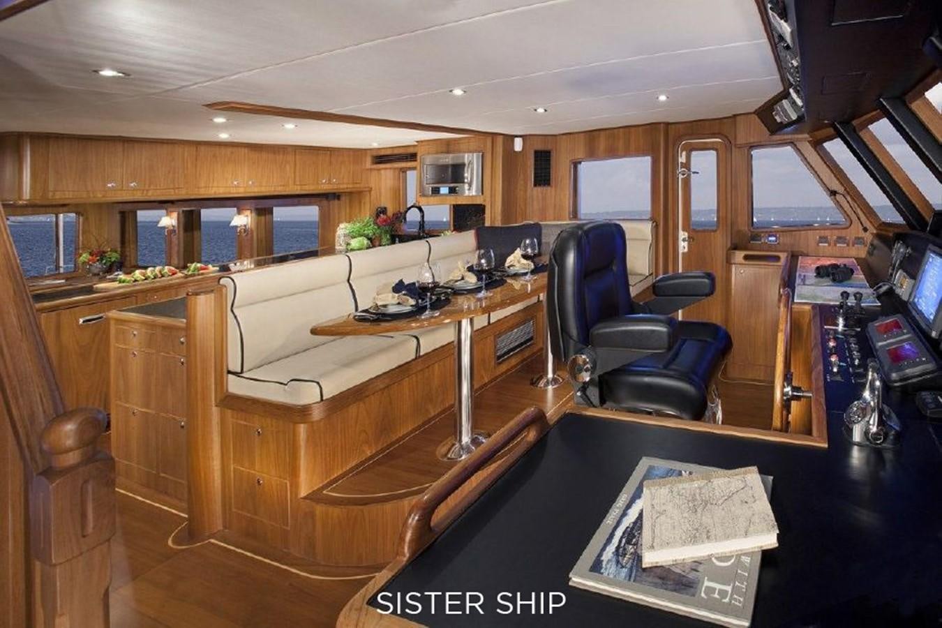 an office with a desk and chairs aboard 700 MY Yacht for Sale