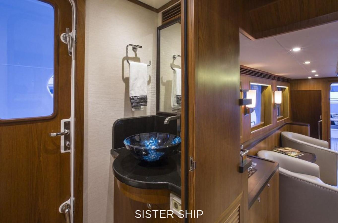 a bathroom with a sink and a bathtub aboard 700 MY Yacht for Sale