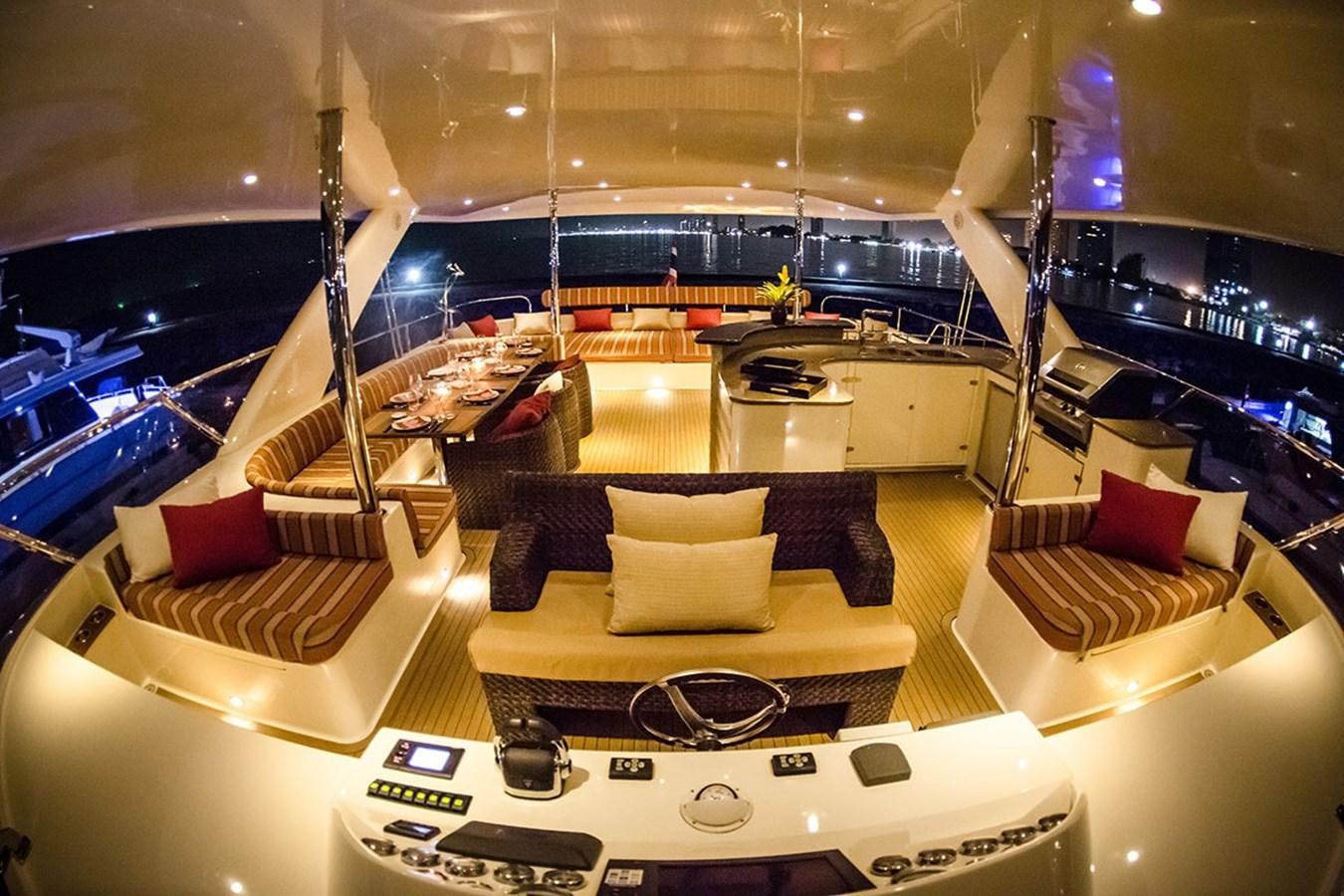 a room with a couch and a television aboard H70 Yacht for Sale