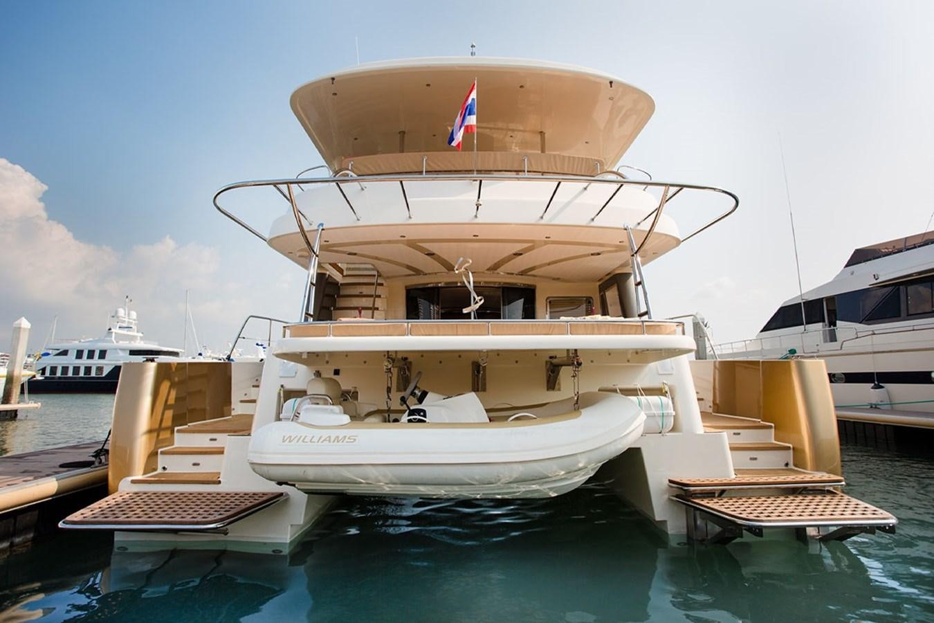 a boat docked at a pier aboard H70 Yacht for Sale