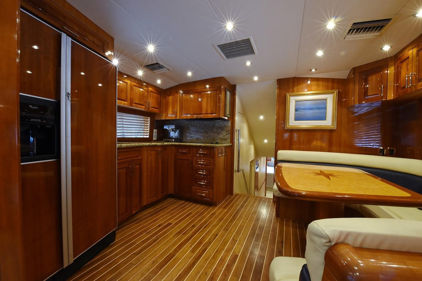 a room with wooden cabinets and a bed aboard AMORE MIO 1 Yacht for Sale