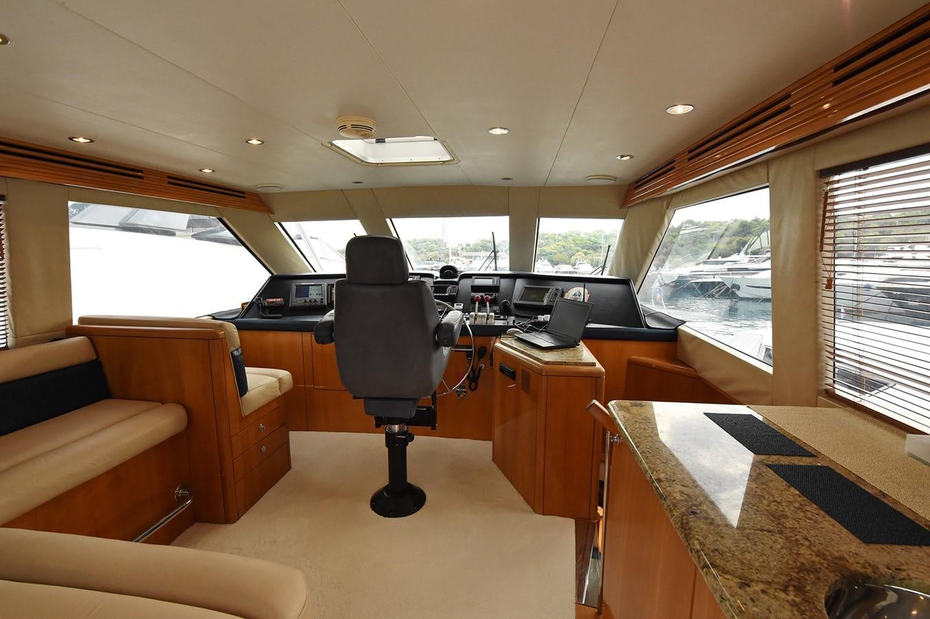 inside of a vehicle with a table and chairs aboard AMORE MIO 1 Yacht for Sale